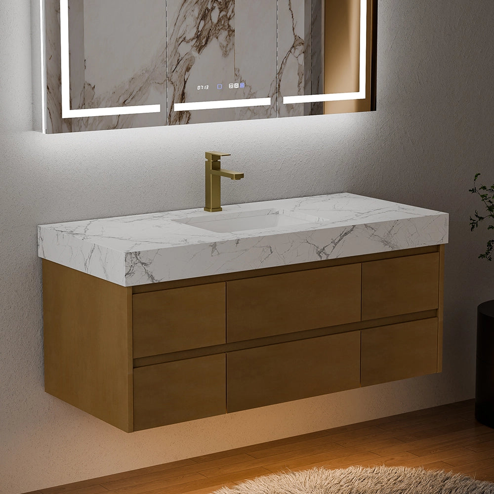 48 Inch Wall Mounted Double Bathroom Vanity with maple wood floating cabinetry and integrated engineered stone sink top with white marble veining, paired with a brass finish faucet and backlit marble mirror; showcased in a dimly lit modern bathroom with warm ambient lighting and wooden flooring, highlighting sleek contemporary design.