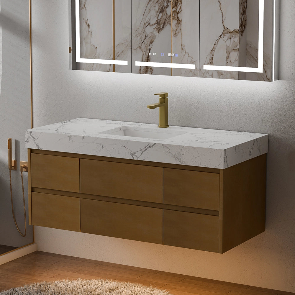 48 Inch Wall Mounted Double Bathroom Vanity crafted with maple wood cabinetry and engineered stone countertop with natural white marble veining, complemented by a brass single-lever faucet and a marble-framed LED backlit mirror; presented in a modern bathroom with warm under-cabinet lighting, wooden flooring and a fluffy white rug, embodying a blend of minimalist design and luxury texture.