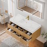 48 Inch Wall Mounted Double Bathroom Vanity with light oak cabinetry featuring multiple pull-out storage drawers (filled with bathroom essentials) and engineered stone countertop with white marble veining; paired with a brass faucet and marble-framed mirror, set in a bright modern bathroom with wooden flooring, white fluffy rug and glass shower enclosure, highlighting ample storage and sleek floating design.